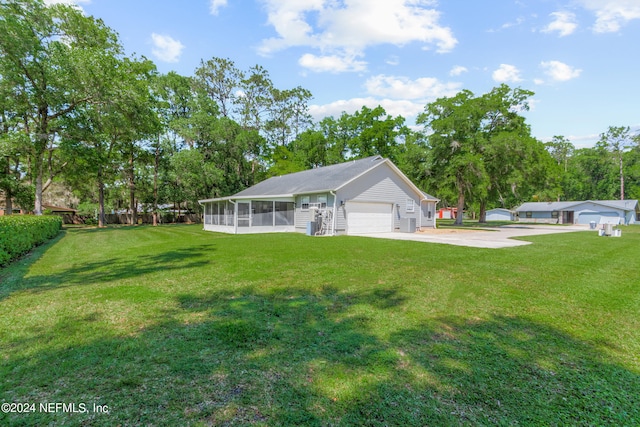 view of yard featuring a garage