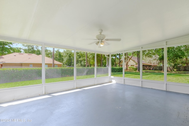 unfurnished sunroom with vaulted ceiling and ceiling fan