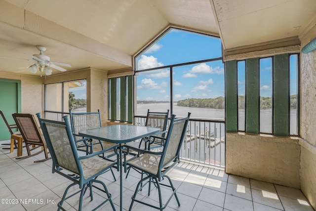 sunroom / solarium with vaulted ceiling, a water view, and ceiling fan