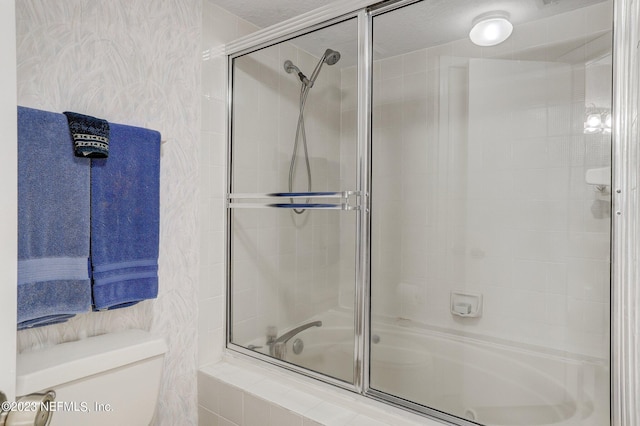 bathroom featuring toilet and a textured ceiling