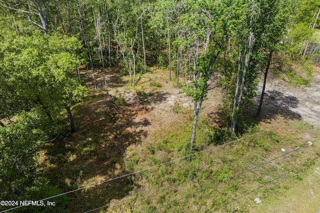 view of landscape with a forest view