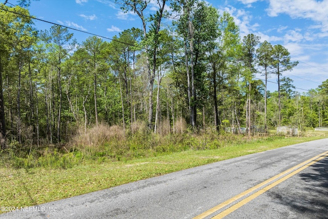 view of road with a view of trees