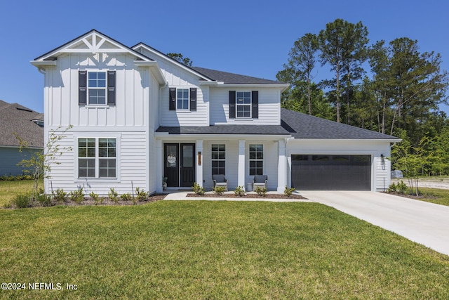 modern farmhouse style home featuring driveway, a shingled roof, an attached garage, board and batten siding, and a front yard