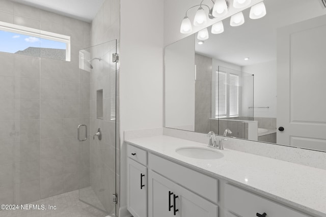 bathroom with a stall shower and vanity