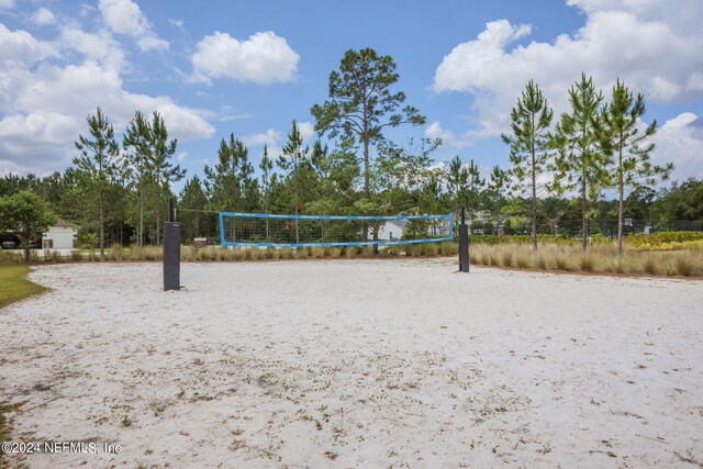 view of home's community featuring volleyball court