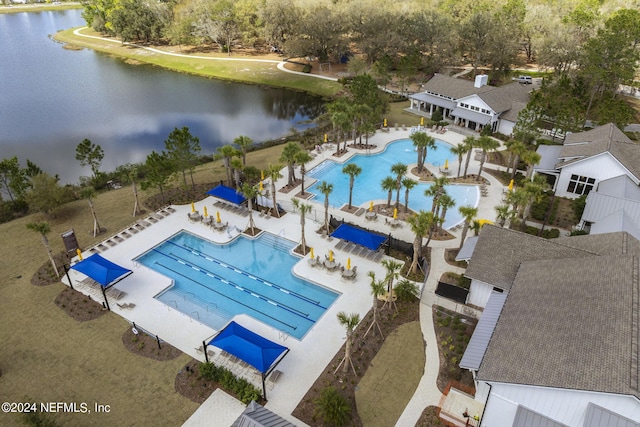 birds eye view of property with a water view