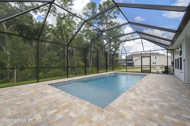 pool with a patio and a lanai