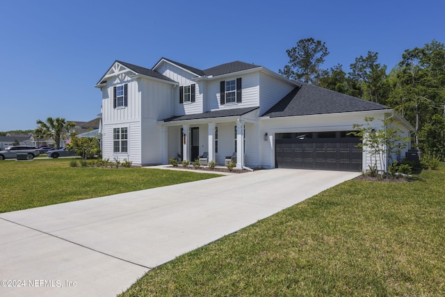 modern farmhouse style home featuring an attached garage, driveway, a front lawn, and board and batten siding