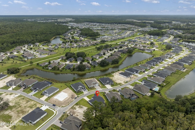 bird's eye view with a water view and a residential view