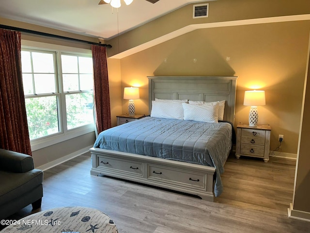 bedroom with ceiling fan and wood-type flooring