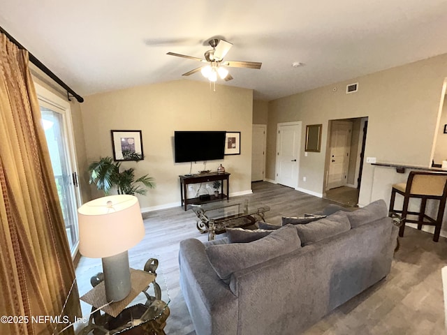 living room with ceiling fan and hardwood / wood-style floors