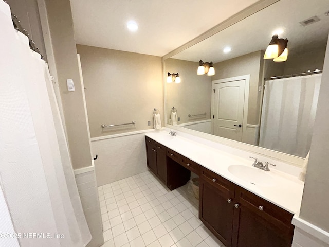 bathroom with tile patterned flooring and vanity