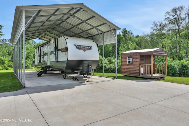 view of parking with a yard and a carport