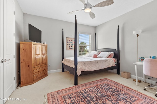 carpeted bedroom with a closet and ceiling fan