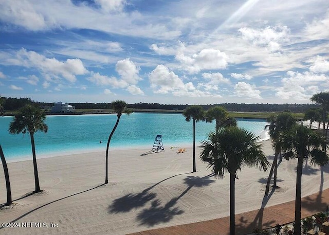 view of water feature with a beach view