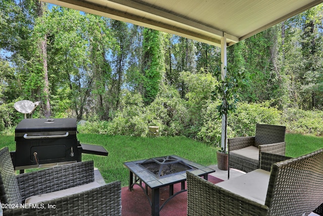 view of terrace featuring a fire pit and area for grilling