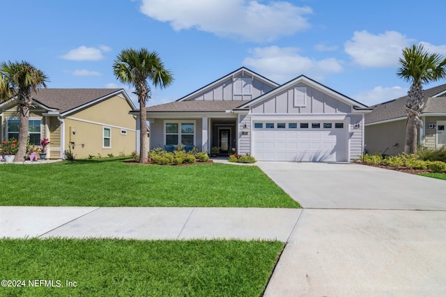 view of front facade featuring an attached garage, a front lawn, board and batten siding, and concrete driveway