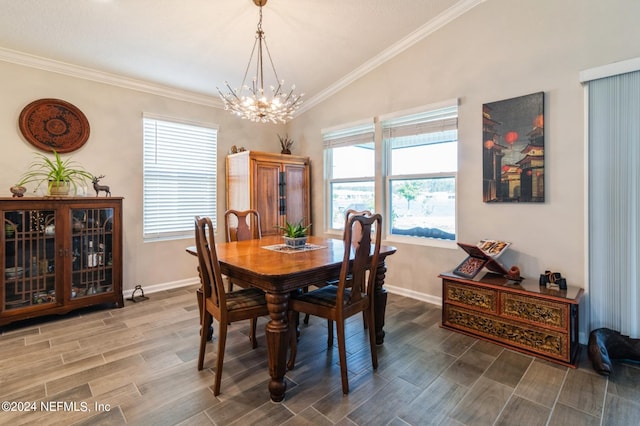 dining area featuring lofted ceiling, crown molding, wood finish floors, and an inviting chandelier