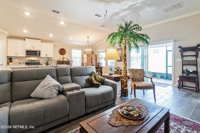 living room with visible vents and crown molding