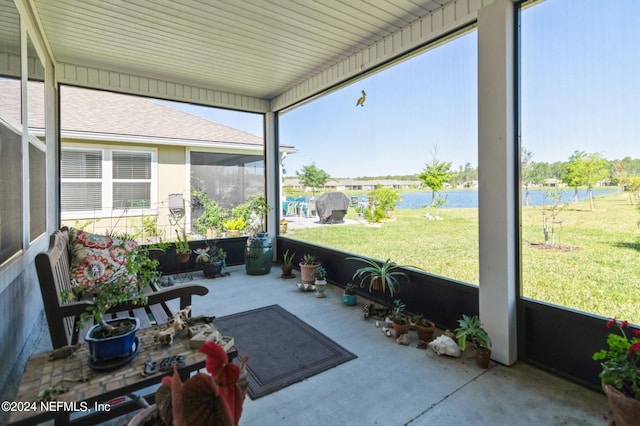 sunroom with a water view