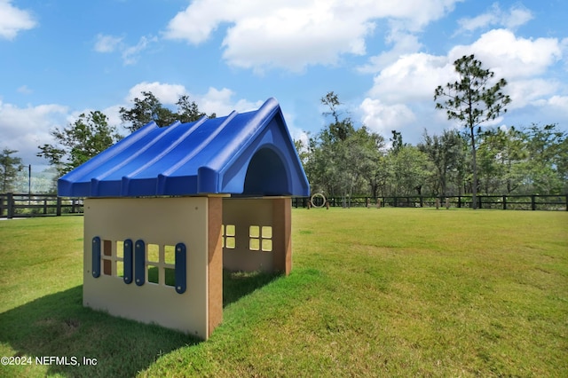 exterior space featuring a yard and fence