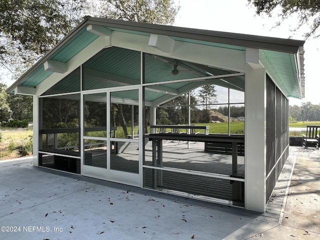 surrounding community featuring a carport and a water view