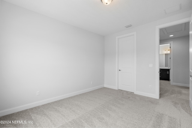 unfurnished bedroom with light carpet