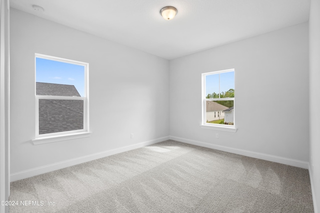 empty room featuring carpet flooring