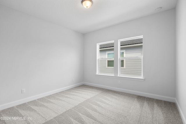 spare room with carpet flooring