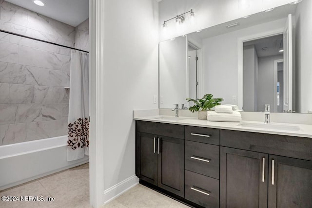 bathroom with tile patterned floors, vanity, and shower / tub combo