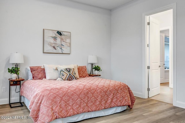 bedroom with light hardwood / wood-style floors