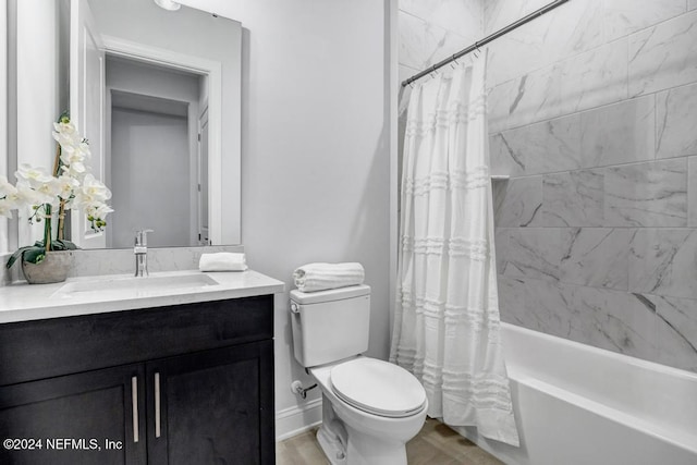 full bathroom featuring shower / bath combo with shower curtain, vanity, hardwood / wood-style floors, and toilet