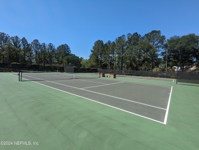 view of sport court featuring community basketball court and fence