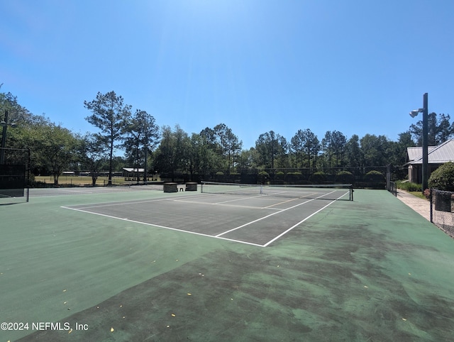 view of sport court with fence