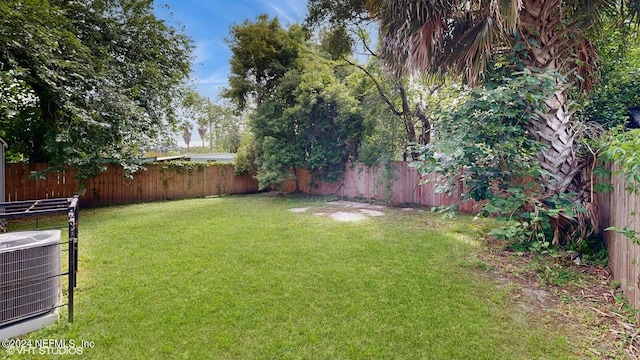 view of yard featuring central AC