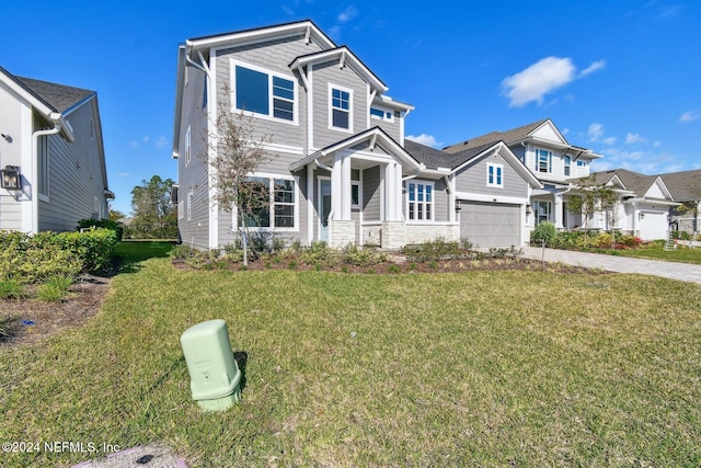 view of front of house with a garage and a front yard