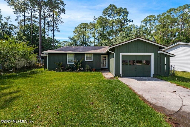 ranch-style home featuring a garage and a front lawn