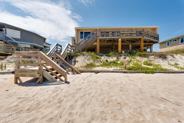 rear view of property with a wooden deck