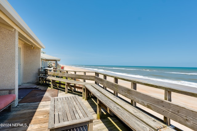 exterior space featuring a water view and a view of the beach