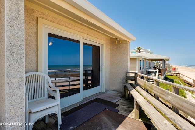 entrance to property with a water view