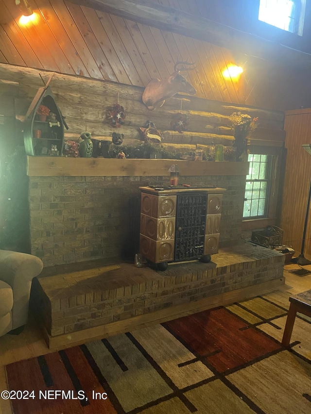 interior details with wood walls, wooden ceiling, and hardwood / wood-style floors