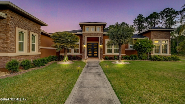 view of front of home featuring a yard