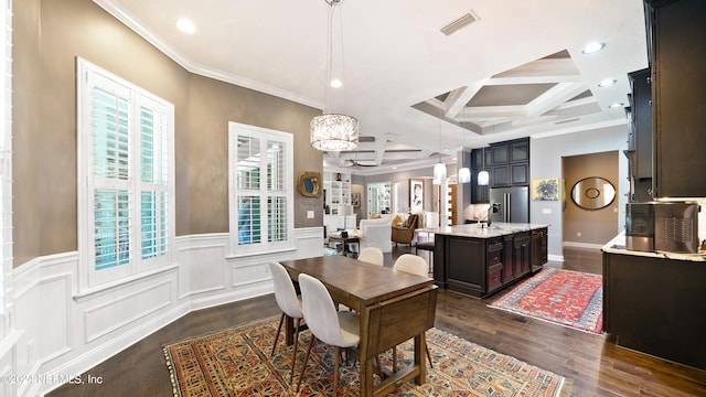 dining space with coffered ceiling, sink, crown molding, a chandelier, and dark hardwood / wood-style floors