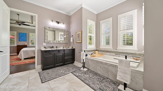 bathroom with tiled tub, ceiling fan, vanity, hardwood / wood-style flooring, and ornamental molding