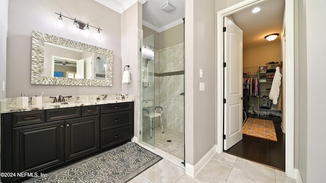 bathroom with hardwood / wood-style flooring, crown molding, an enclosed shower, and vanity