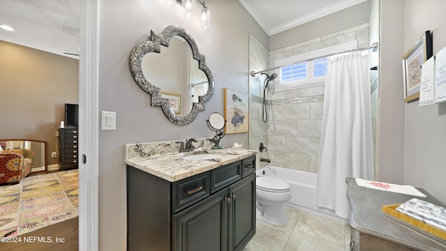 full bathroom with tile flooring, vanity with extensive cabinet space, shower / bath combination with curtain, toilet, and ornamental molding