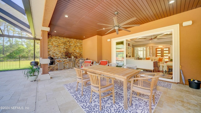 view of terrace with a grill and ceiling fan