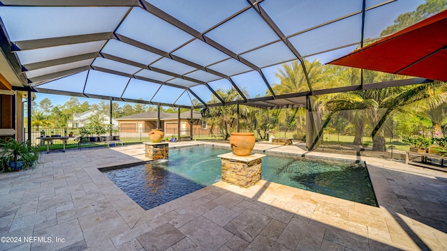 view of swimming pool with a lanai, a jacuzzi, pool water feature, and a patio area