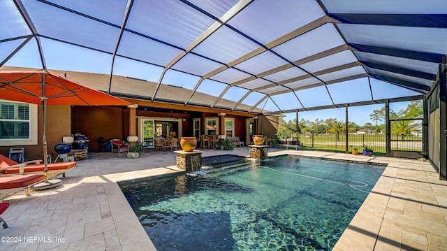 view of pool featuring a patio area, pool water feature, and a lanai