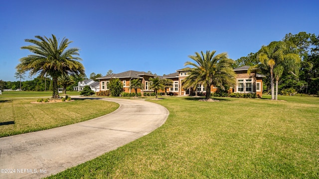 view of home's community featuring a yard